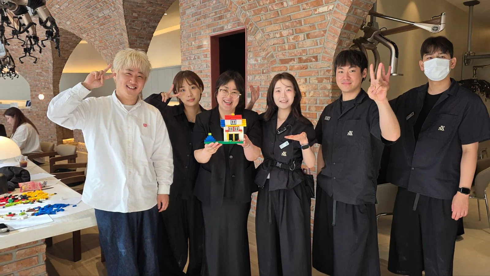 The JUNO HAIR Mangu Station team standing together inside the salon